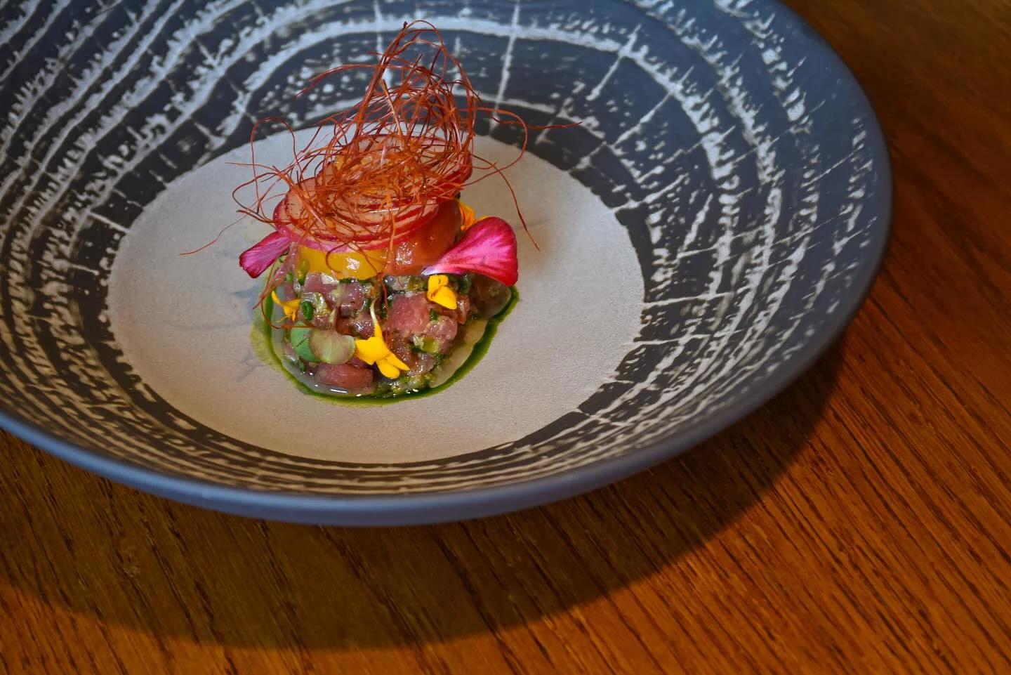 tuna tartare served on a blue and white china bowl at glovers alley a michelin star restaurant in st stephen's green one of the best areas to stay in dublin ireland