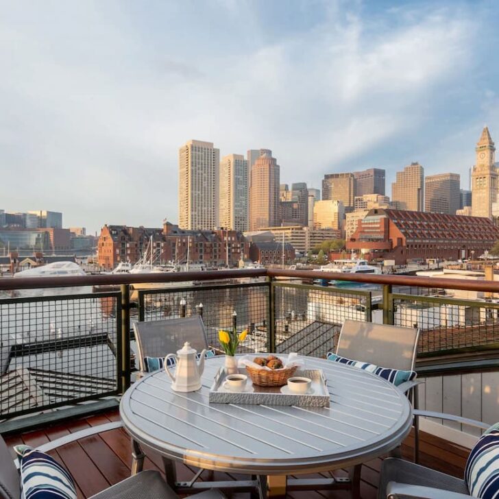 yachts moored with the boston skyline in the background at boston yacht haven on boston waterfront usa
