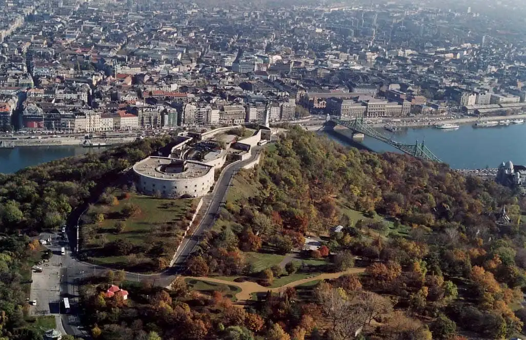 an aerial view of budapest hungary viewed from above the citadella fortification with the danube river in the background