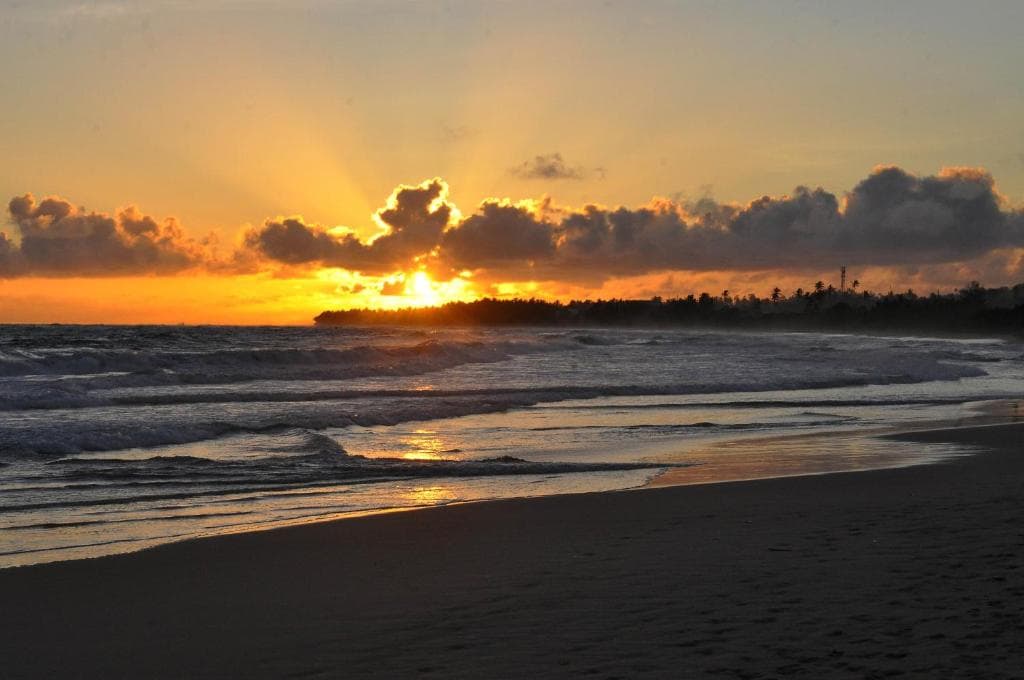 Koggala Beach's sunset changing the sky to all shades of orange and yellow