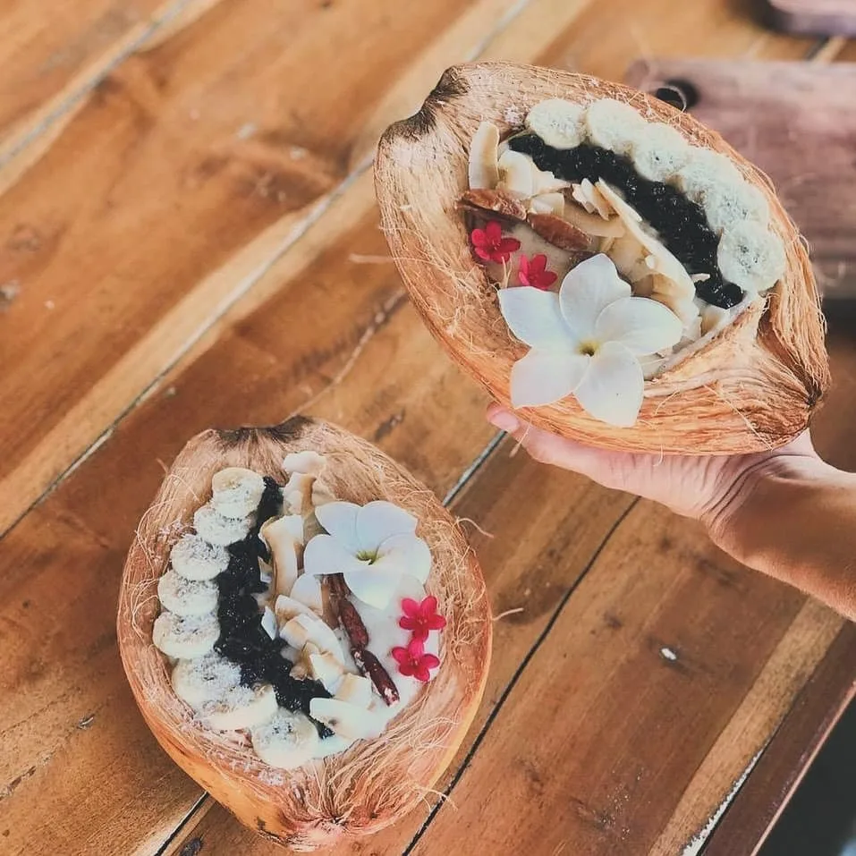 Coconut filled with fresh smoothie bowl ingredients