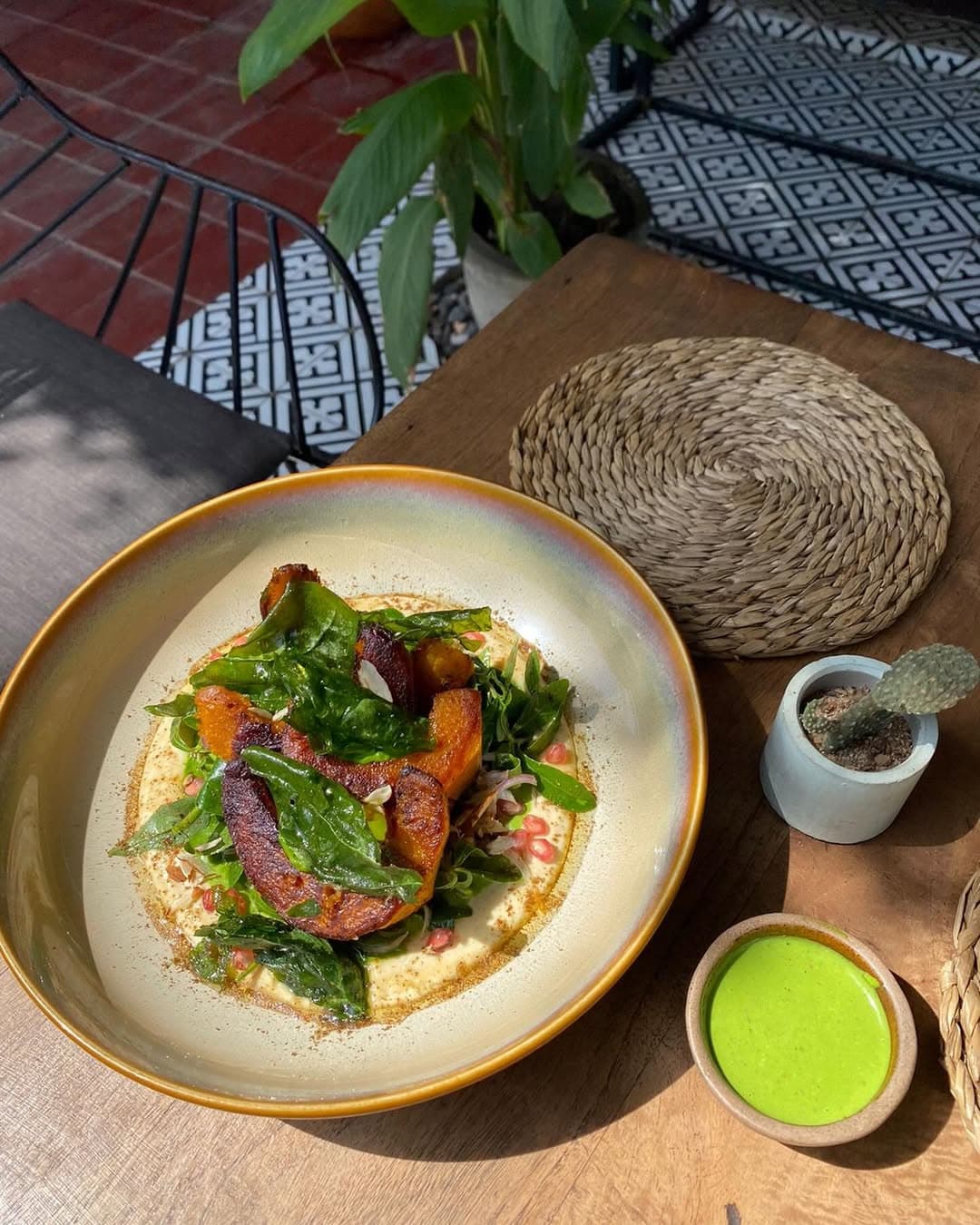 Vegan pumkin steak ona. bed of hummus