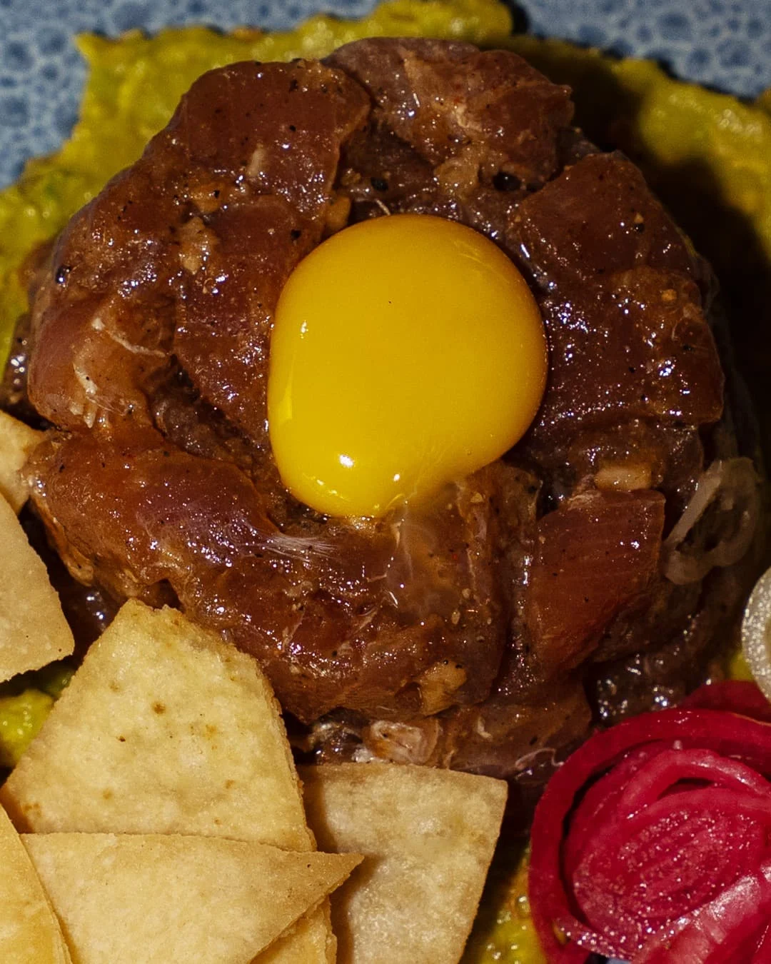 Tuna tartare with cured egg yolk and crispy taco chips