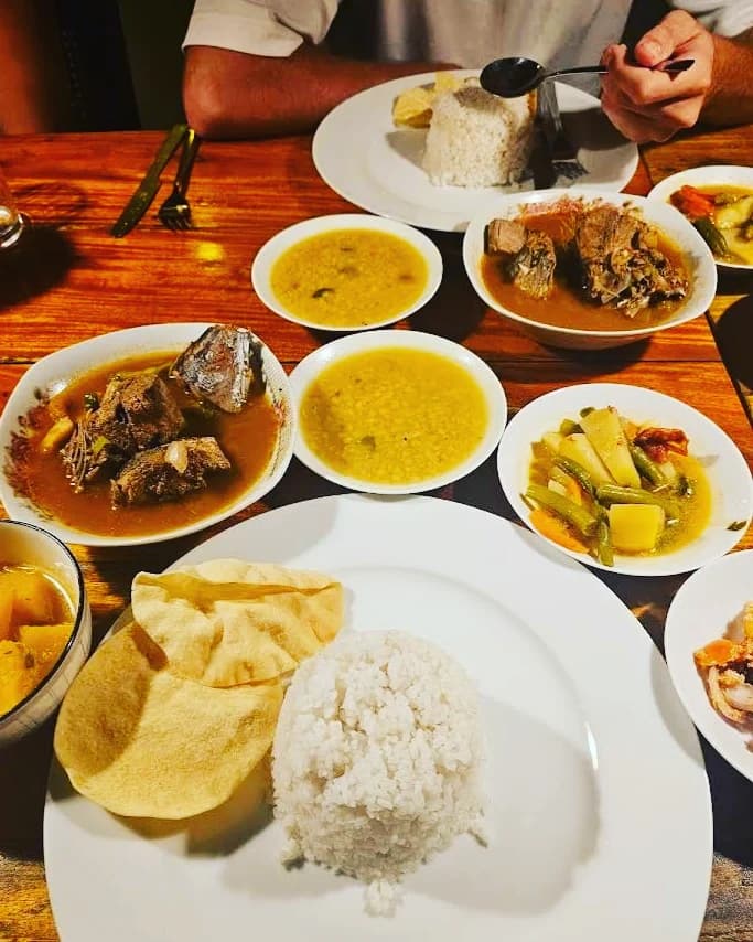 Seafood curry with sambal and rice and dahl