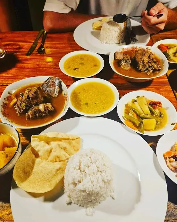 Seafood curry with sambal and rice and dahl