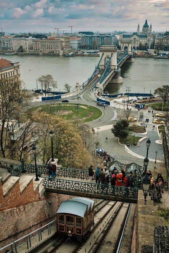 a funicular railway in castle hill the best area to stay in budapest hungary with the danube river in the background