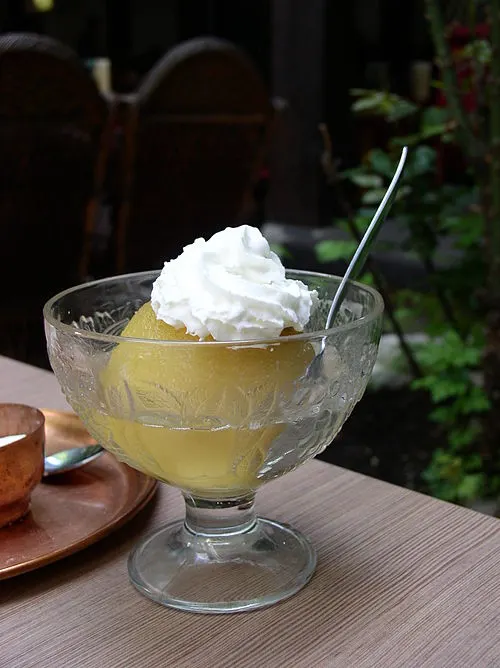 tufahije a balkan dessert consists of a poached apple stuffed with walnuts