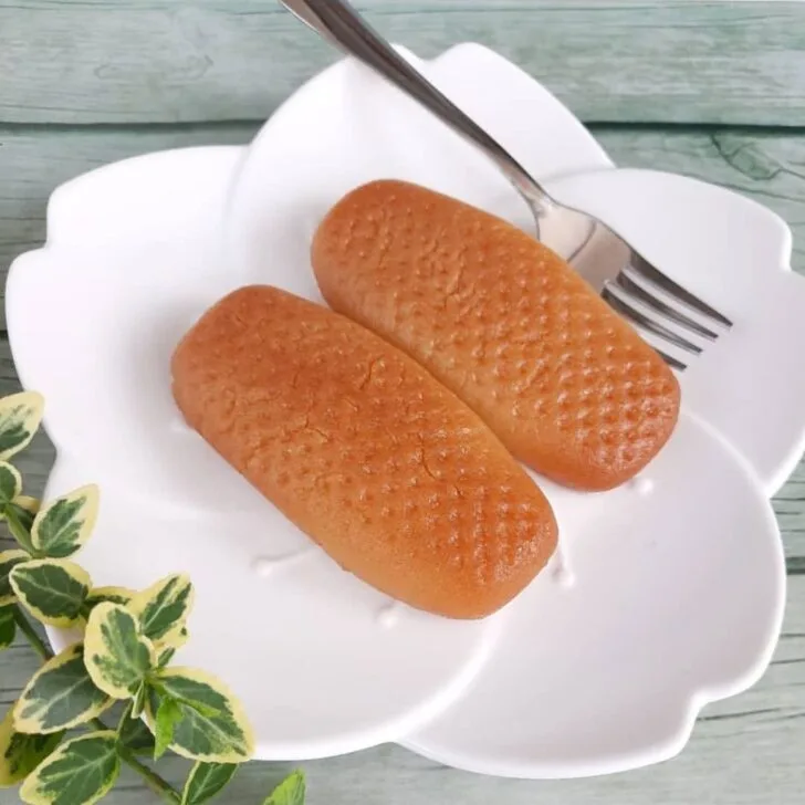 urmasica a popular bosnian dessert on a white plate with a metal fork