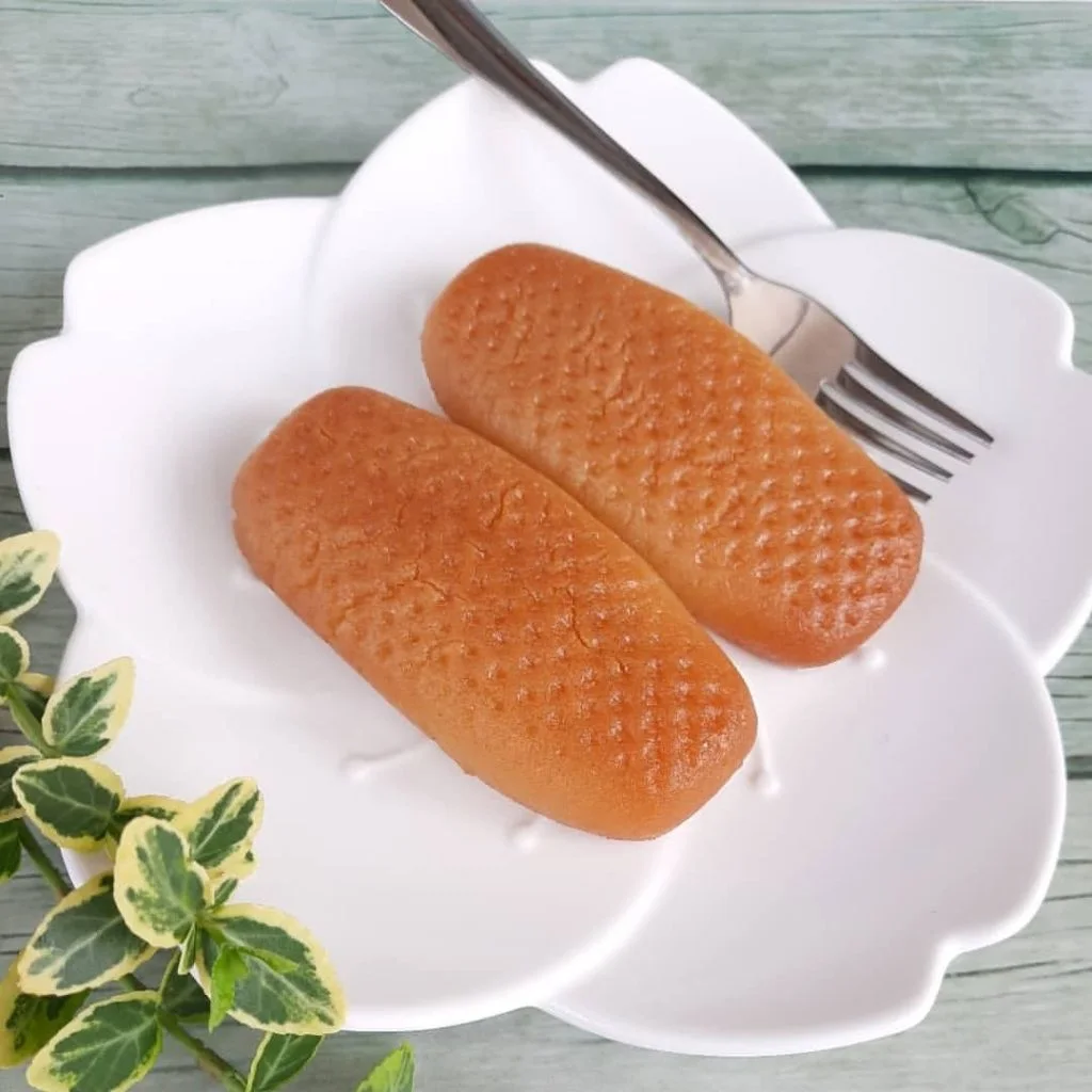 urmasica a popular bosnian dessert on a white plate with a metal fork