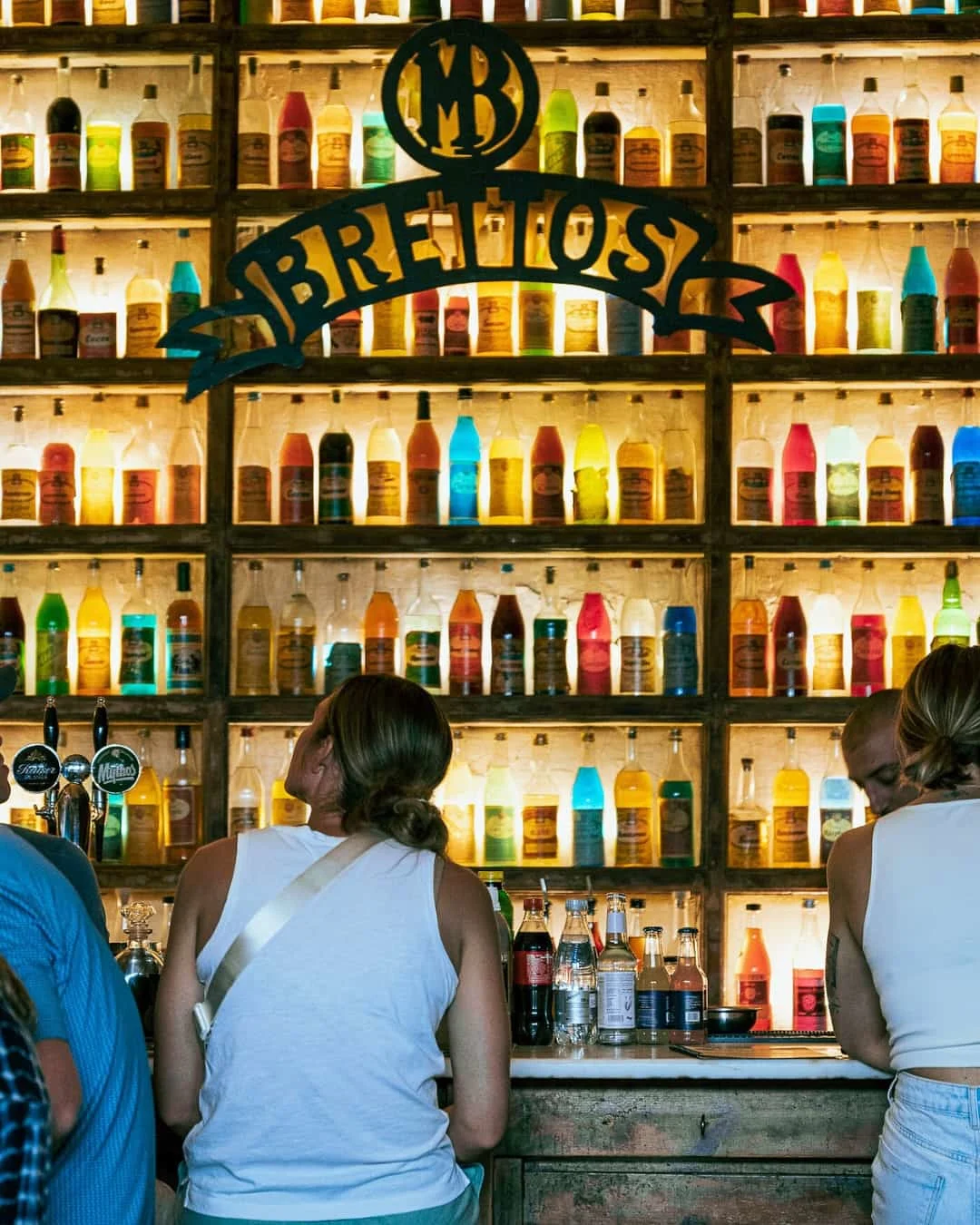 Colorful bottles of Greek liquers and ouzo at Brettos