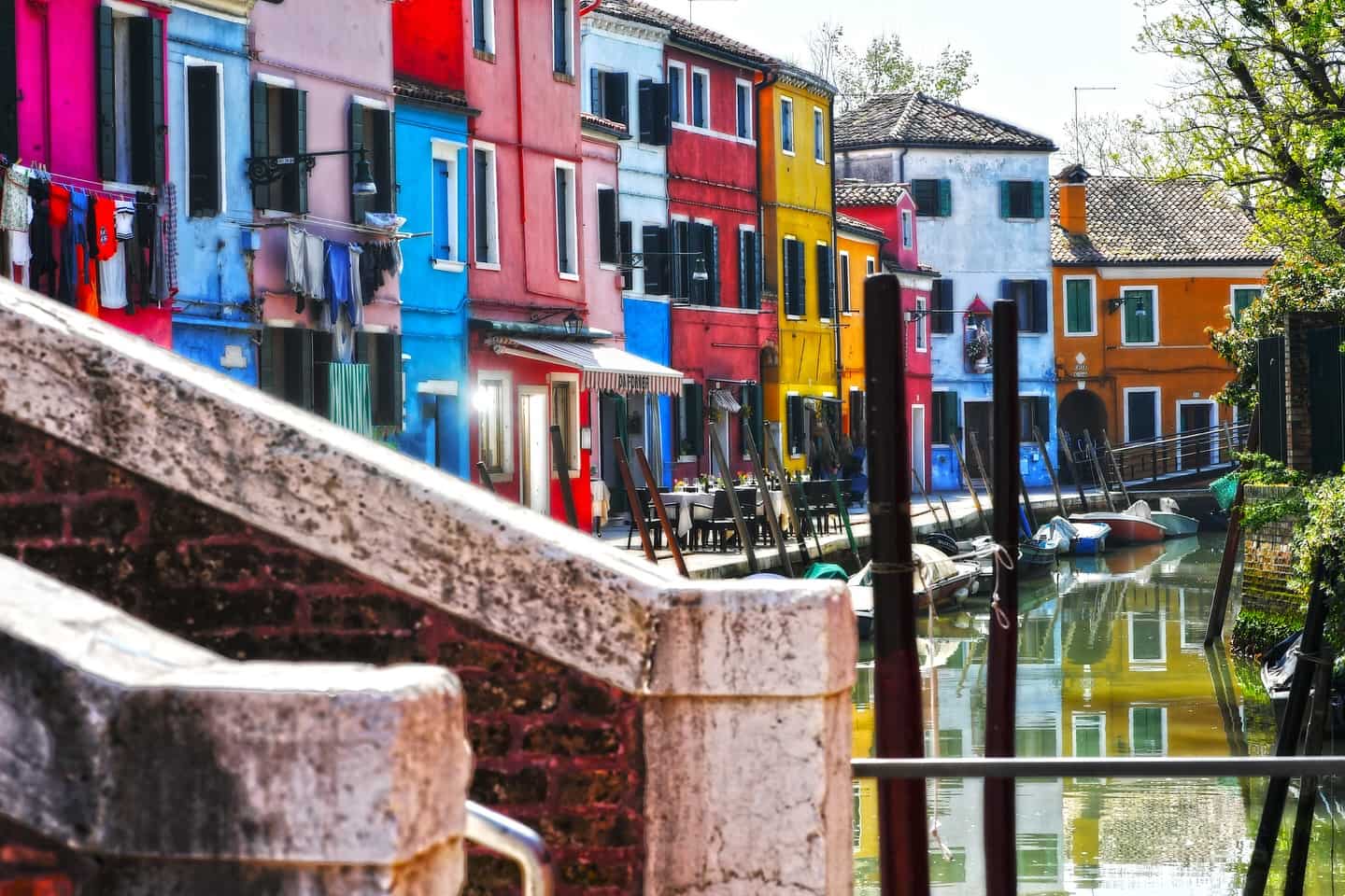 The multi-coloured restaurants and homes in Burano next to the canal