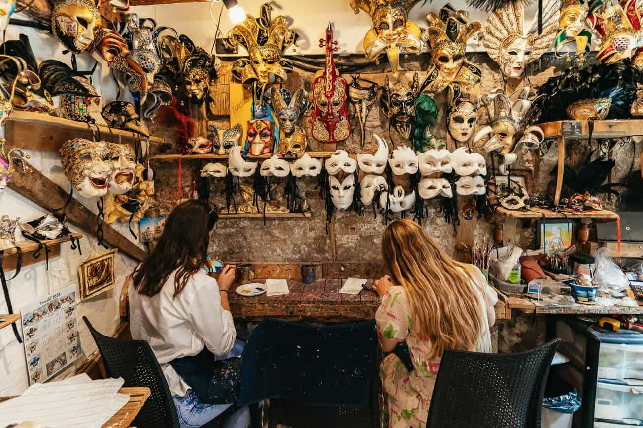 Ladies making their masks at a traditional workshop