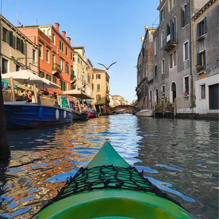 Cruising through Venice canals on a kayak