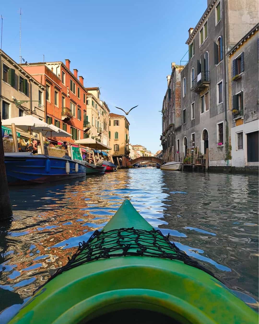 Cruising through Venice canals on a kayak