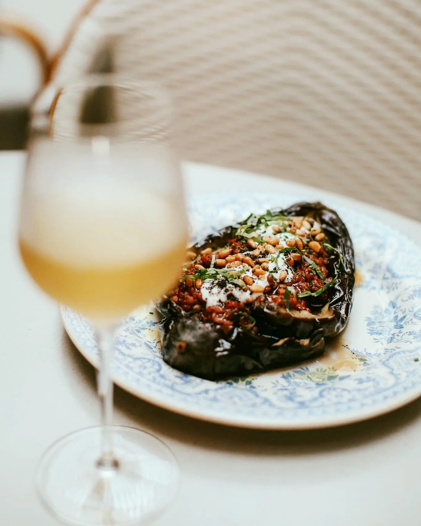 Roasted whole eggplant puy lentils, tomato preserve, yogurt, black olive, pine nuts