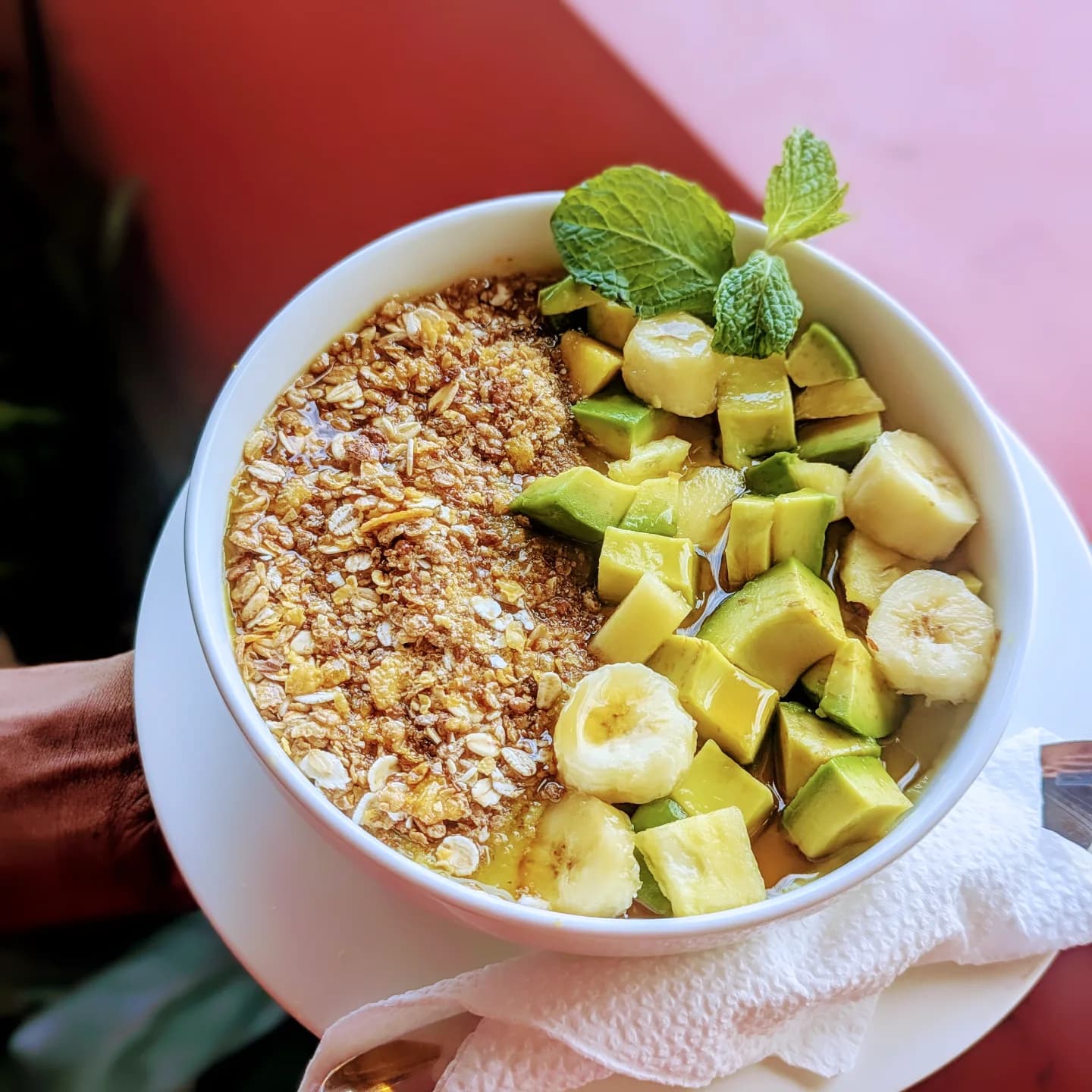 Granola bowl with avo and banana and mint