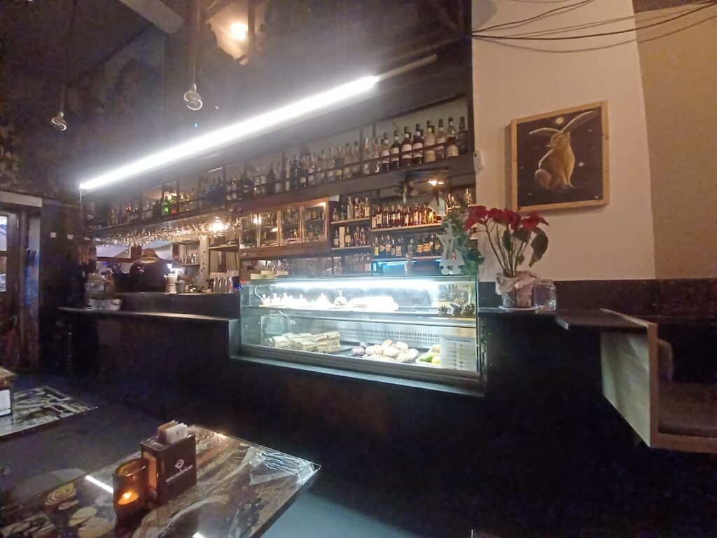 a bar with a sandwich and cake cabinet in trieste italy