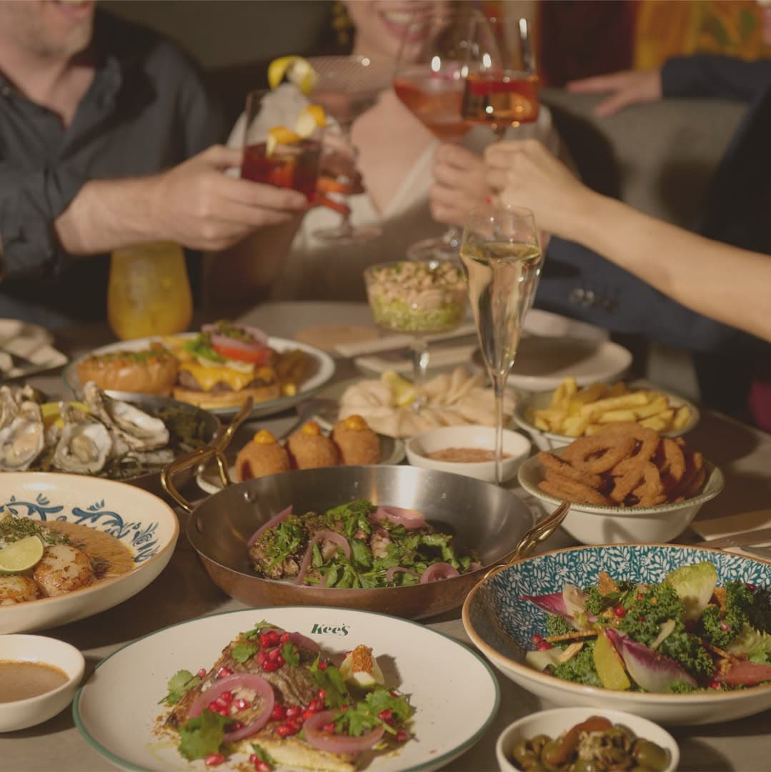 Plates at table with wine and drinks among the best restaurants in Clarke Quay Singapore