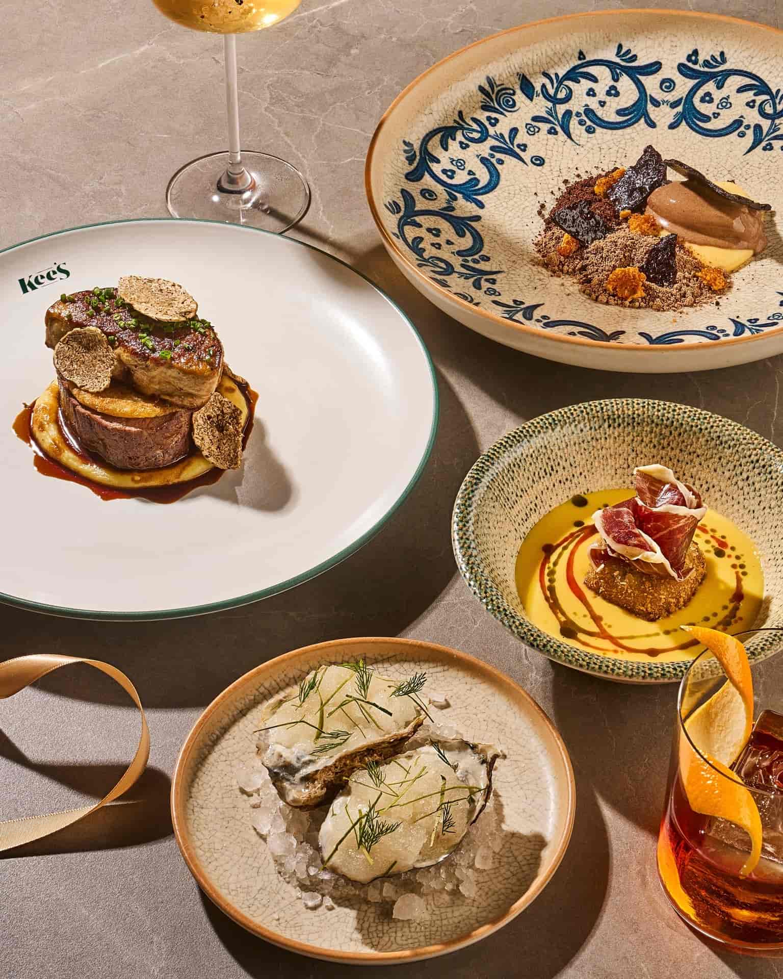 Variety of dishes including fresh oysters, steak and dessert