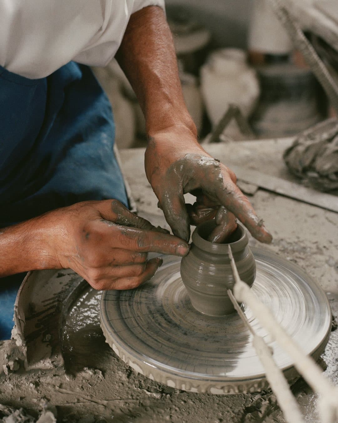 Terra cotta pots being made that potpuri is sold in