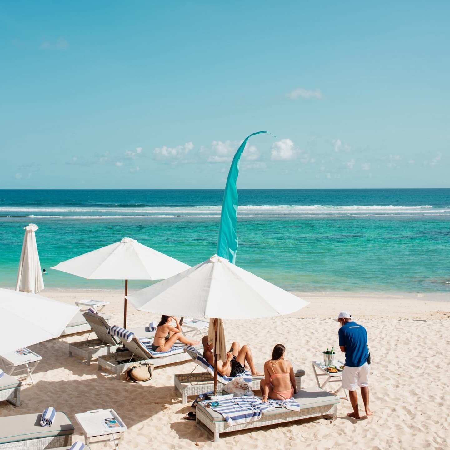 Relax on loungers just inches from the ocean