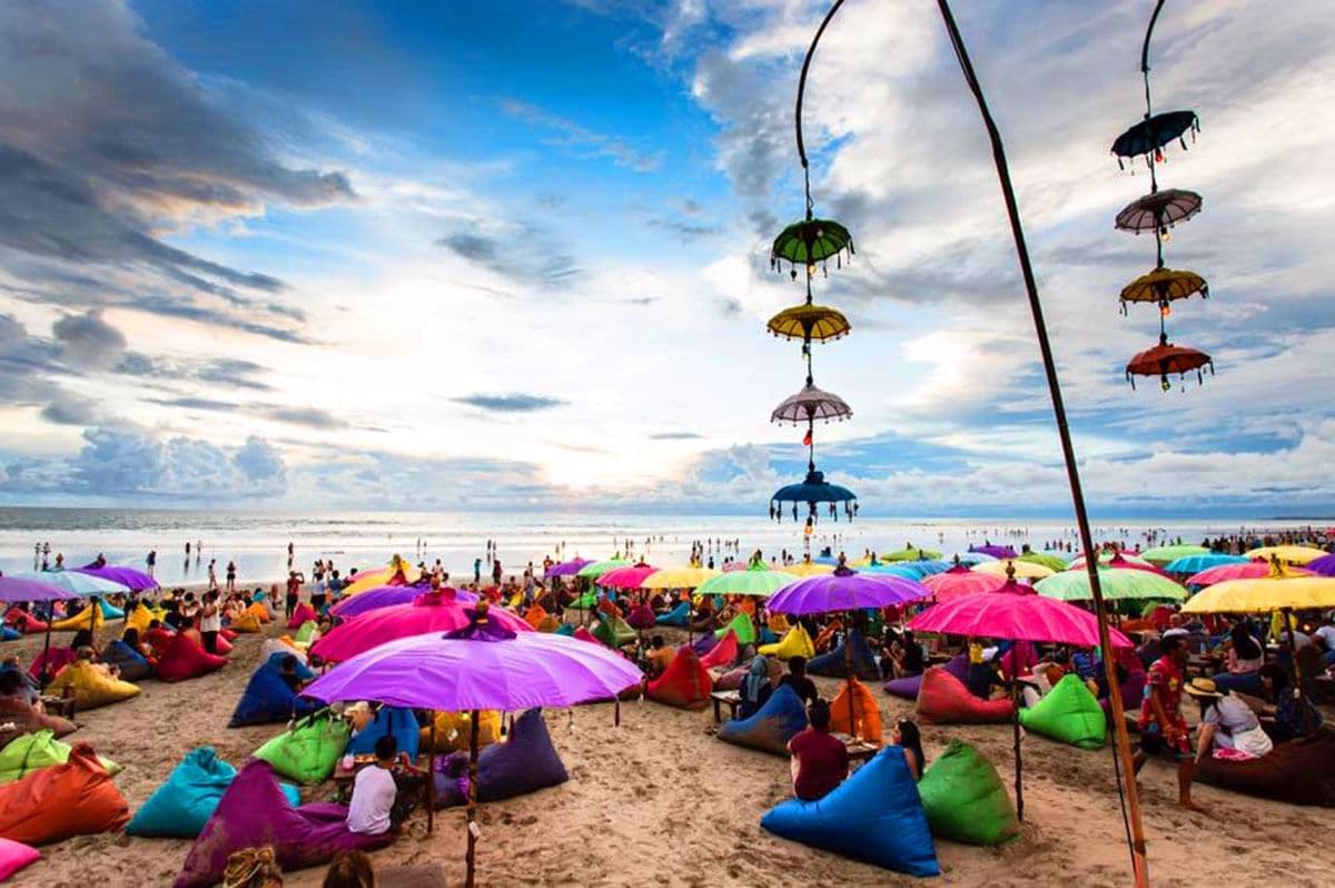 The beach's famous colorful boho umbrellas and beanbags