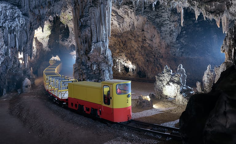 a narrow gauge railway running through postojna cave an ideal day trip from ljubljana slovenia
