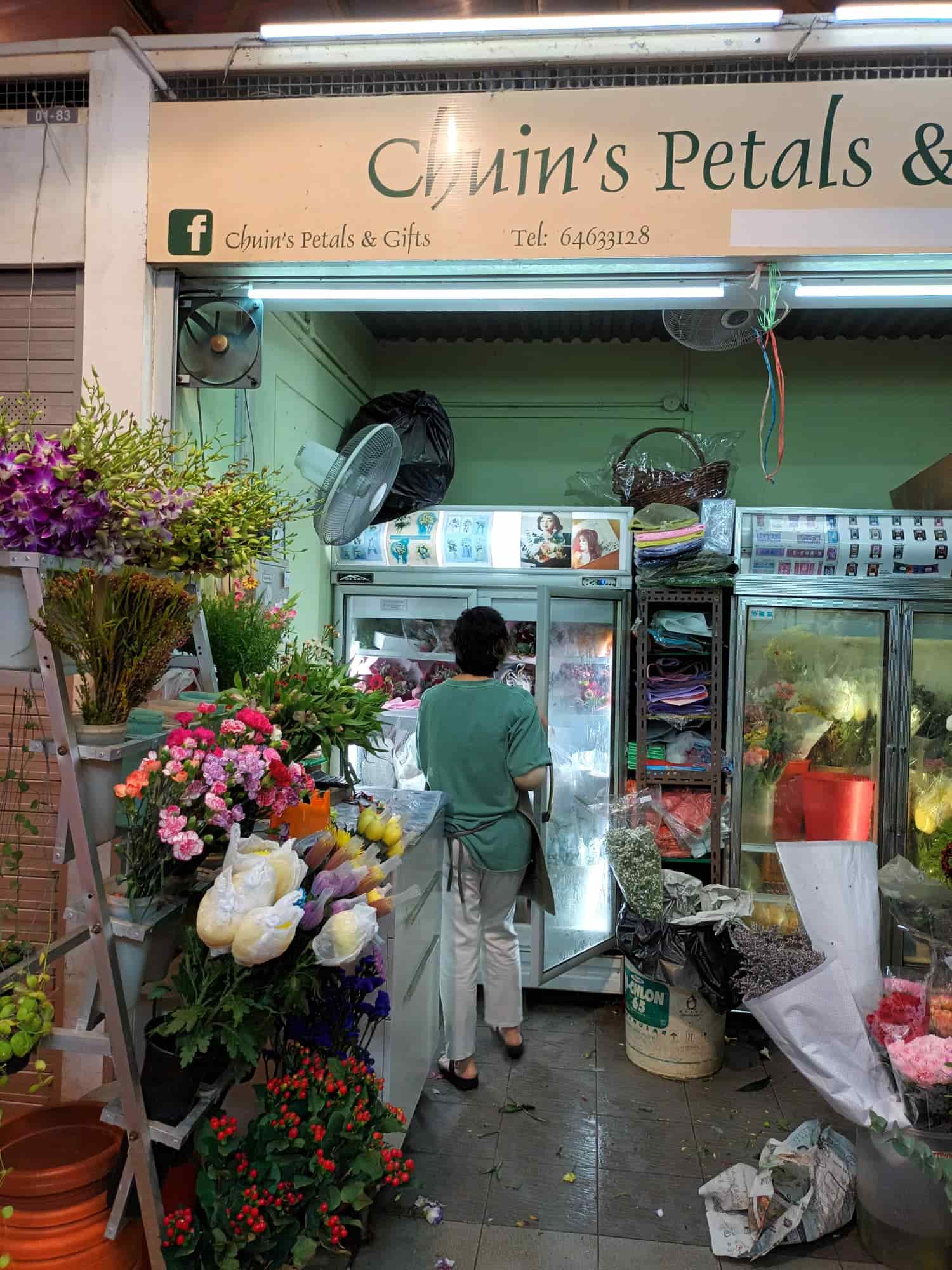 Flower shop selling fresh blooms at the wet market