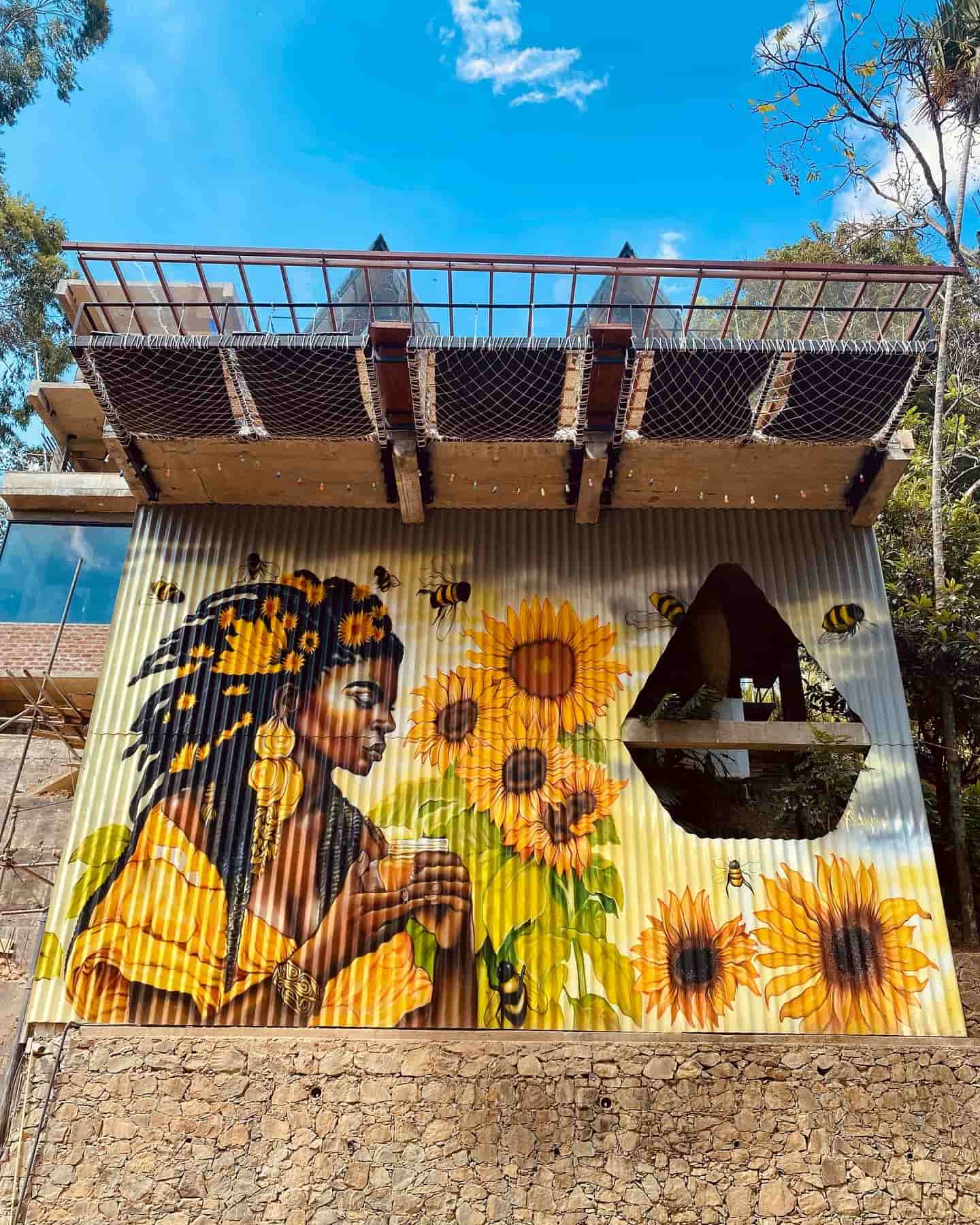 Full front view of mural with net seating above