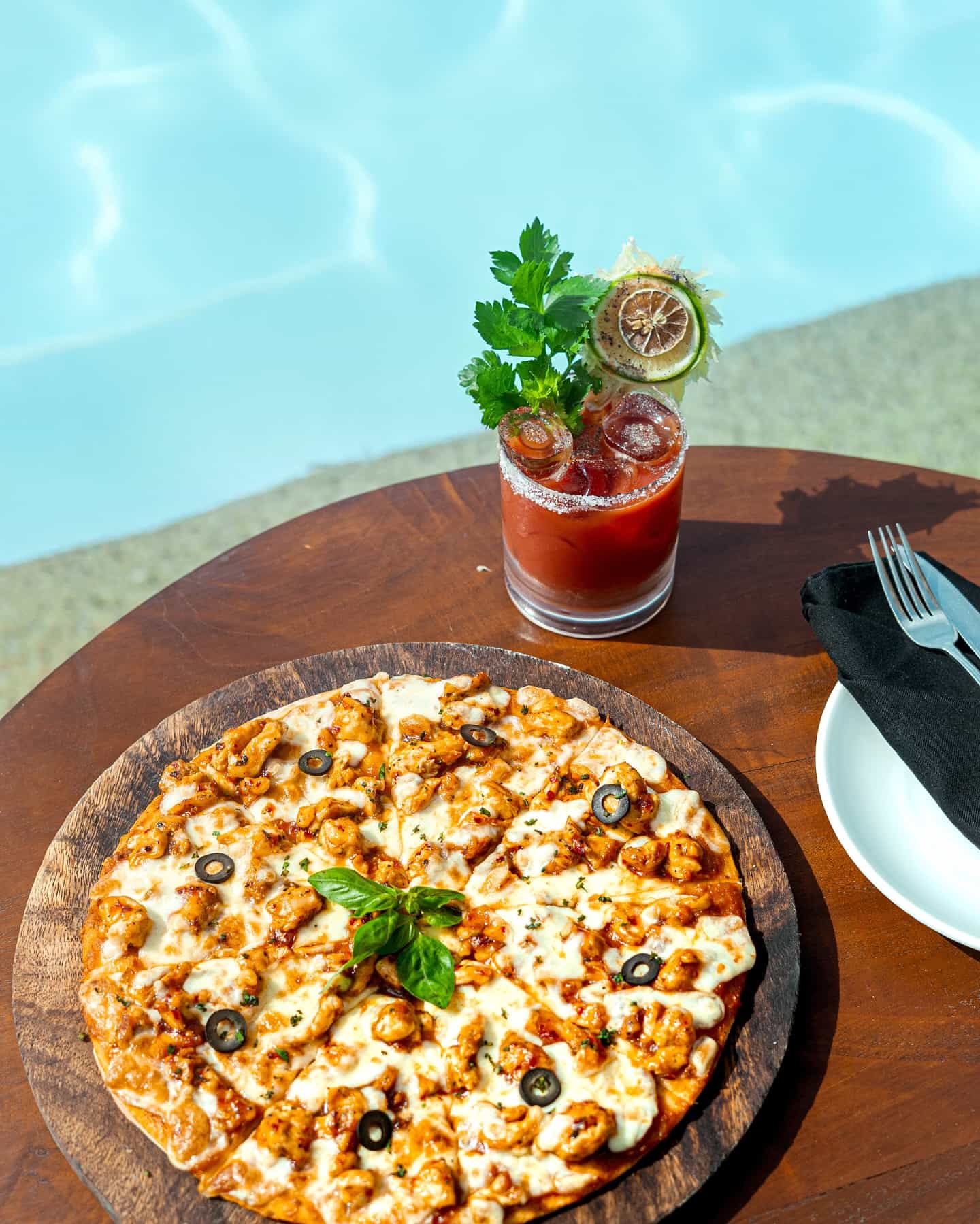 Pizza and cocktails by the pool