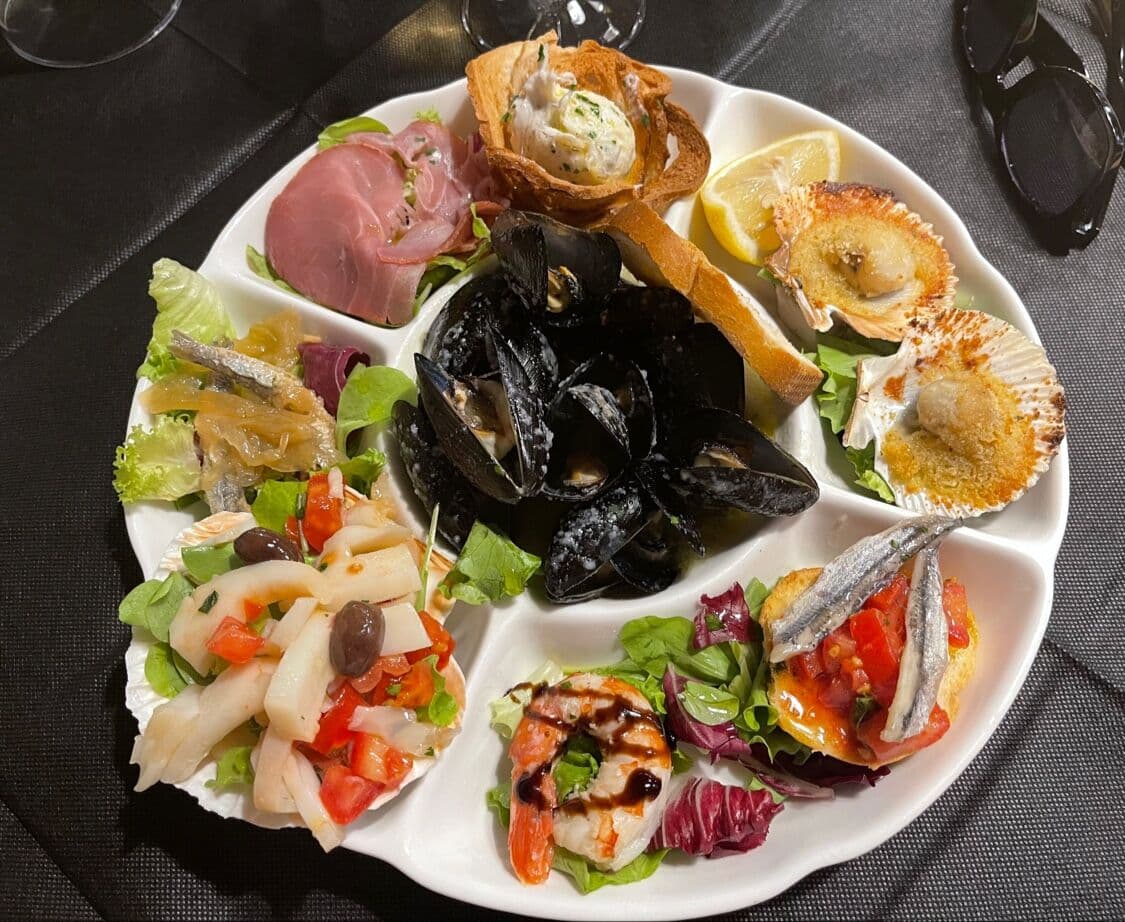 a mixed platter of seafood and salad from da angelina one of the best restaurants in trieste italy