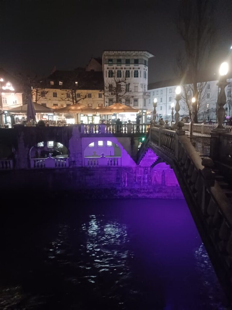 tromostojve bridge illuminated purple at night in ljubljana slovenia