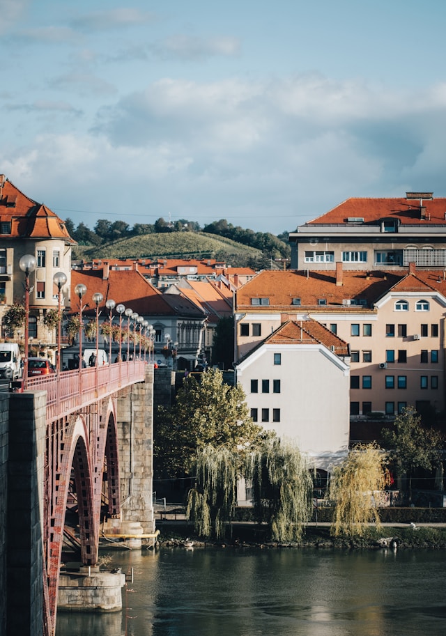 red roofs in the old town of maribor slovenia viewed across the drava river