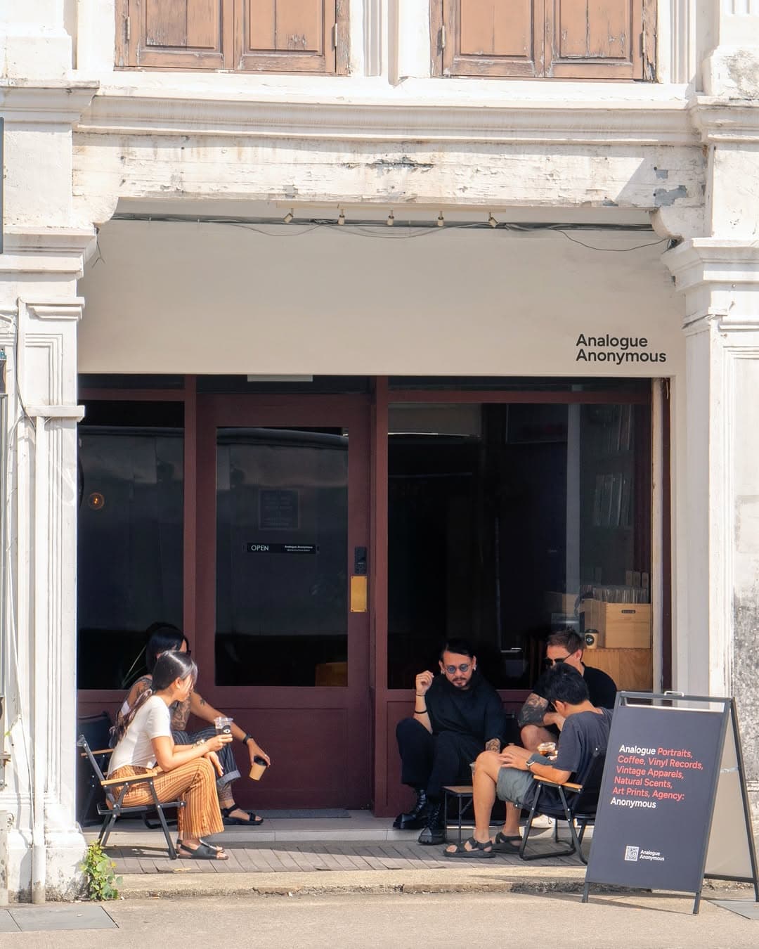 Patrons gatehring outside the coffee shop-meets record store