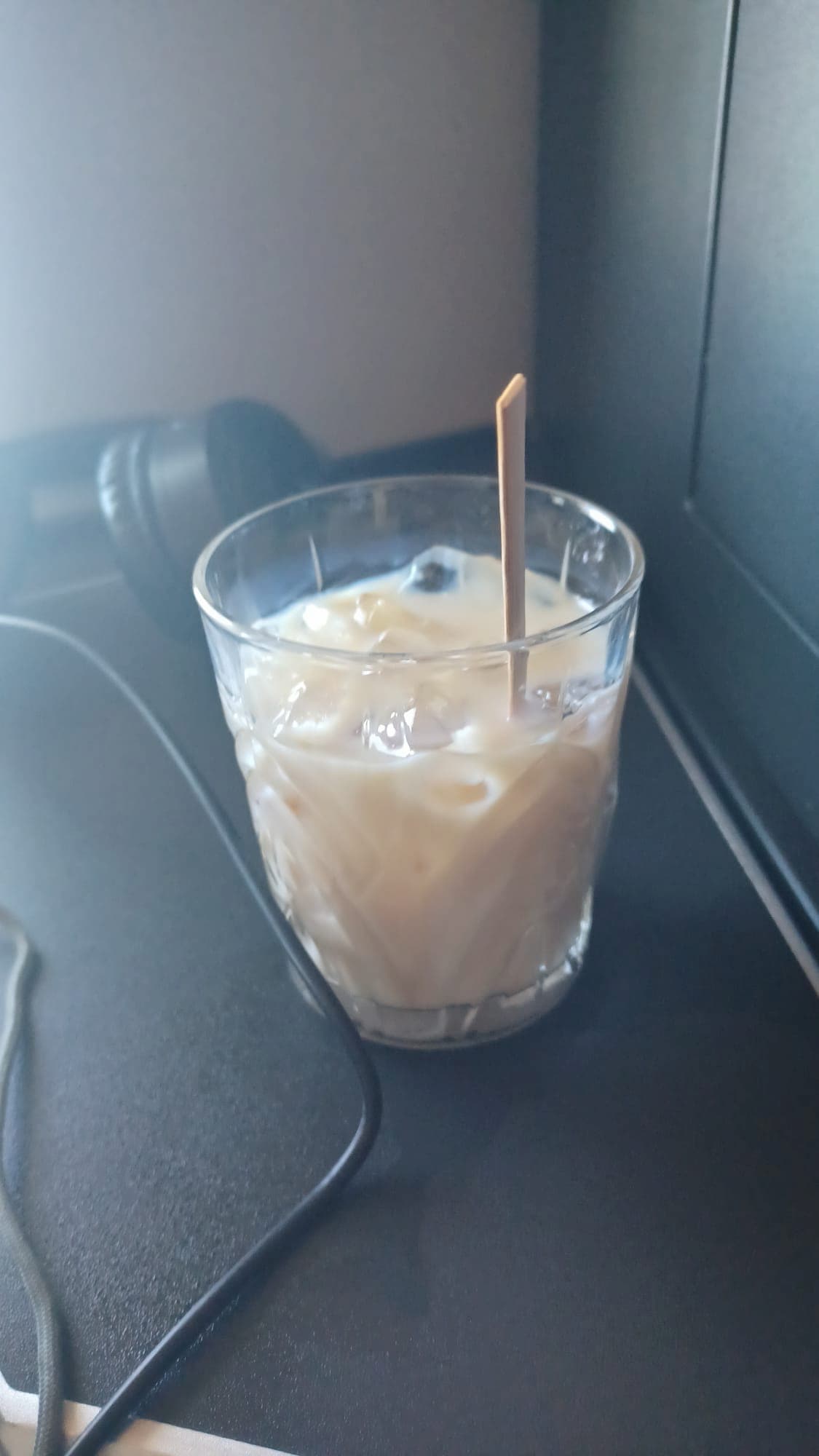 a glass of baileys irish cream liquer on an airplane