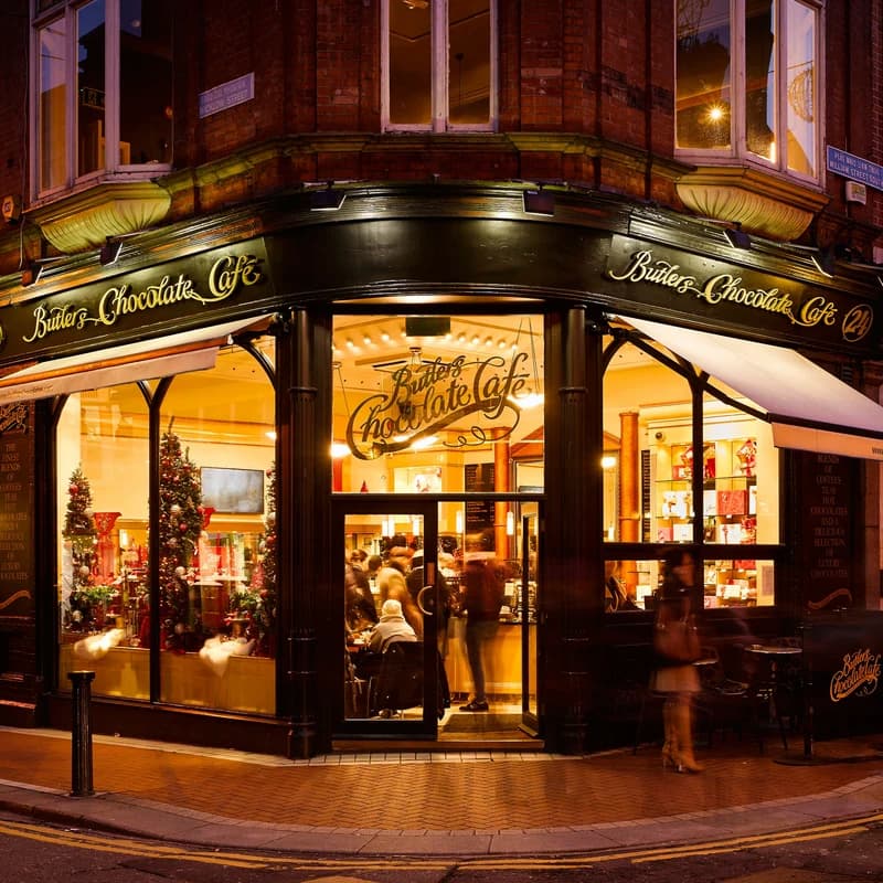 butlers chocolate cafe on a street corner in dublin ireland at night