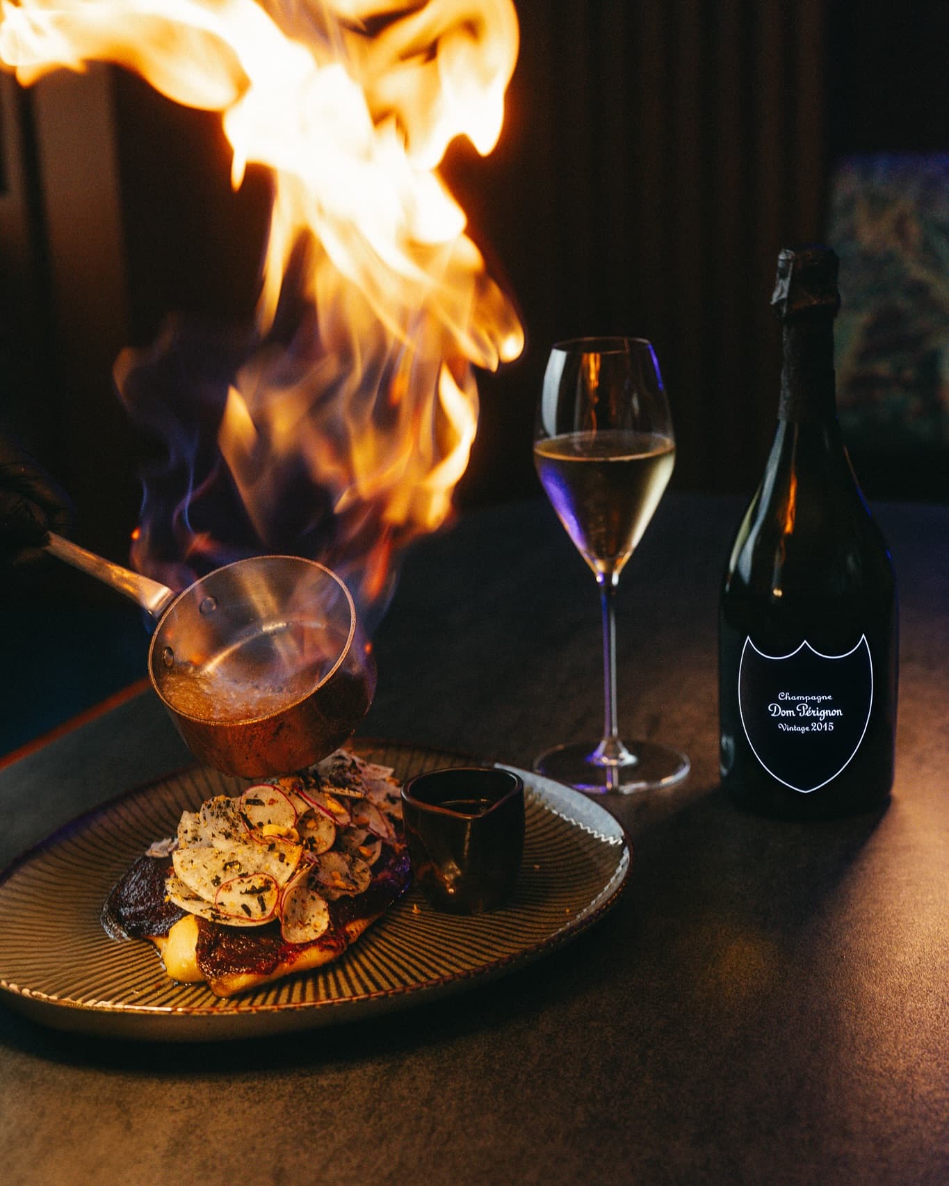 Flmae grilled food and don perignon champagne