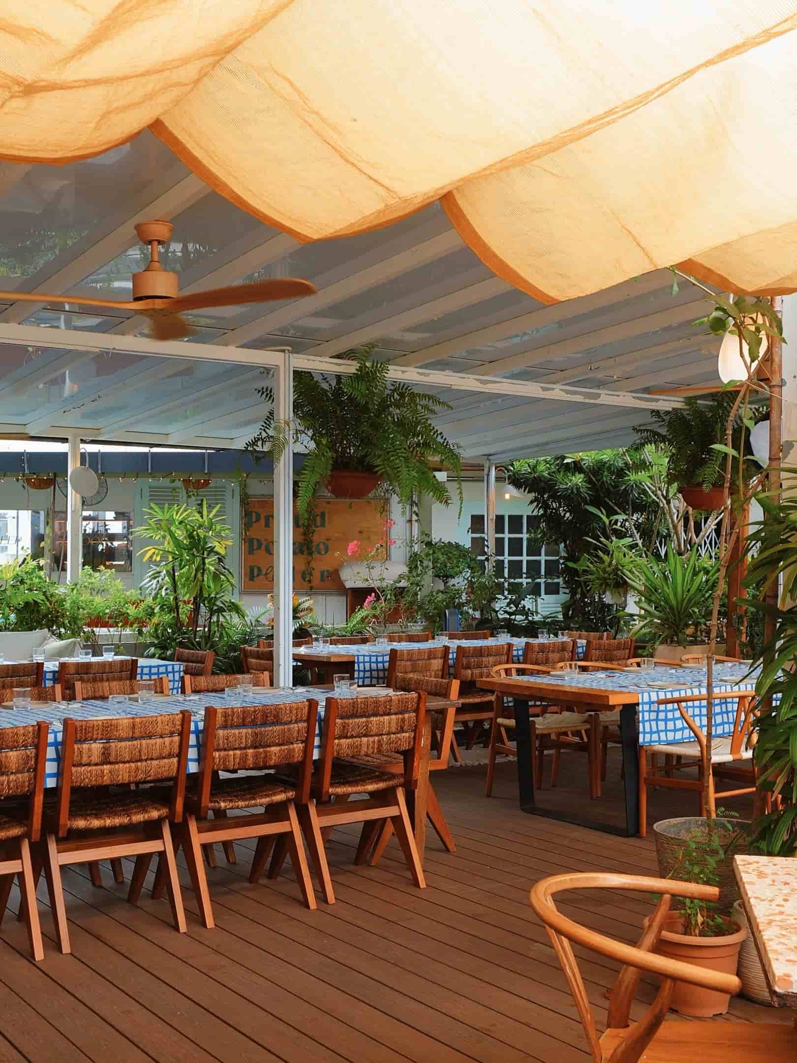 Outdoor seating beneath the rooftop at Alani